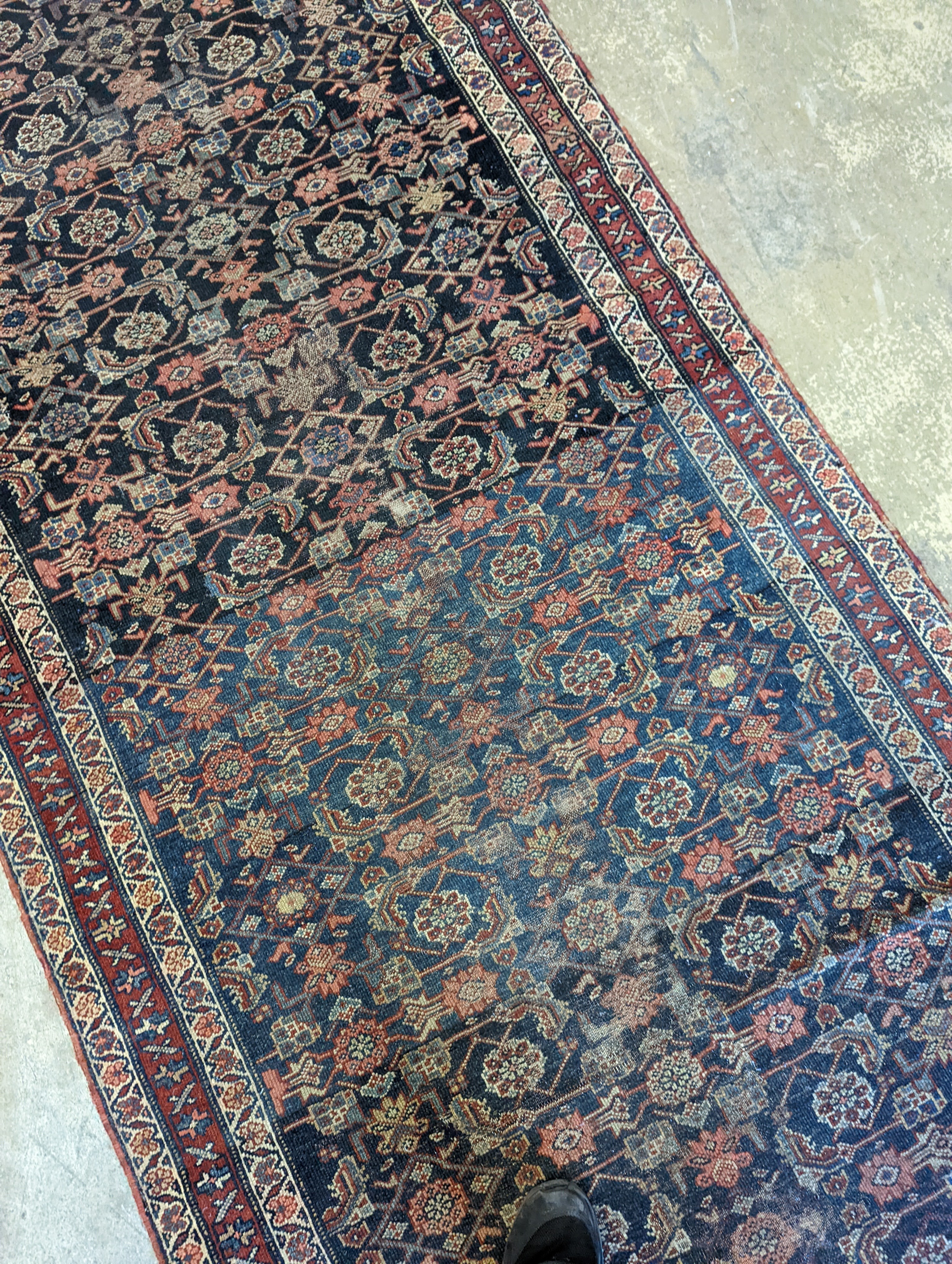 An antique Shirvan blue ground runner, 470 x 116cm